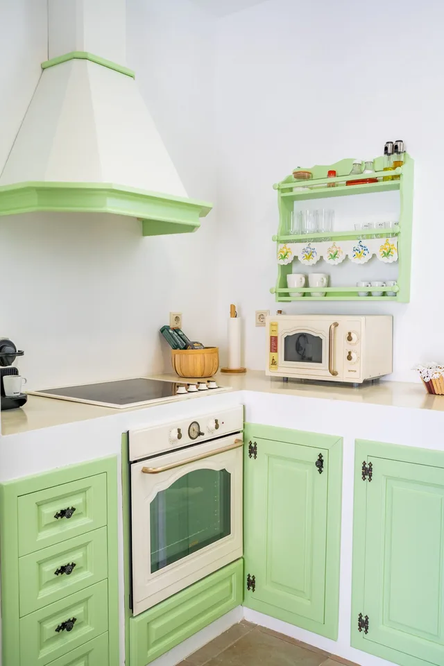 Green fully equipped kitchen at Sea La Vue accommodation in Karpathos