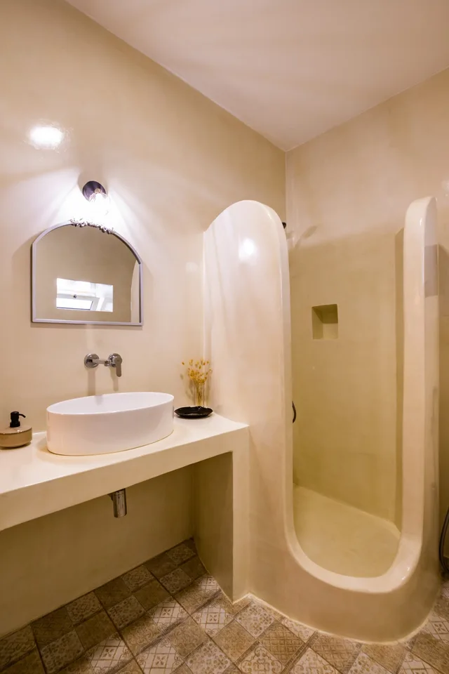 Curved built shower in the Sea La Vue bathroom in Karpathos