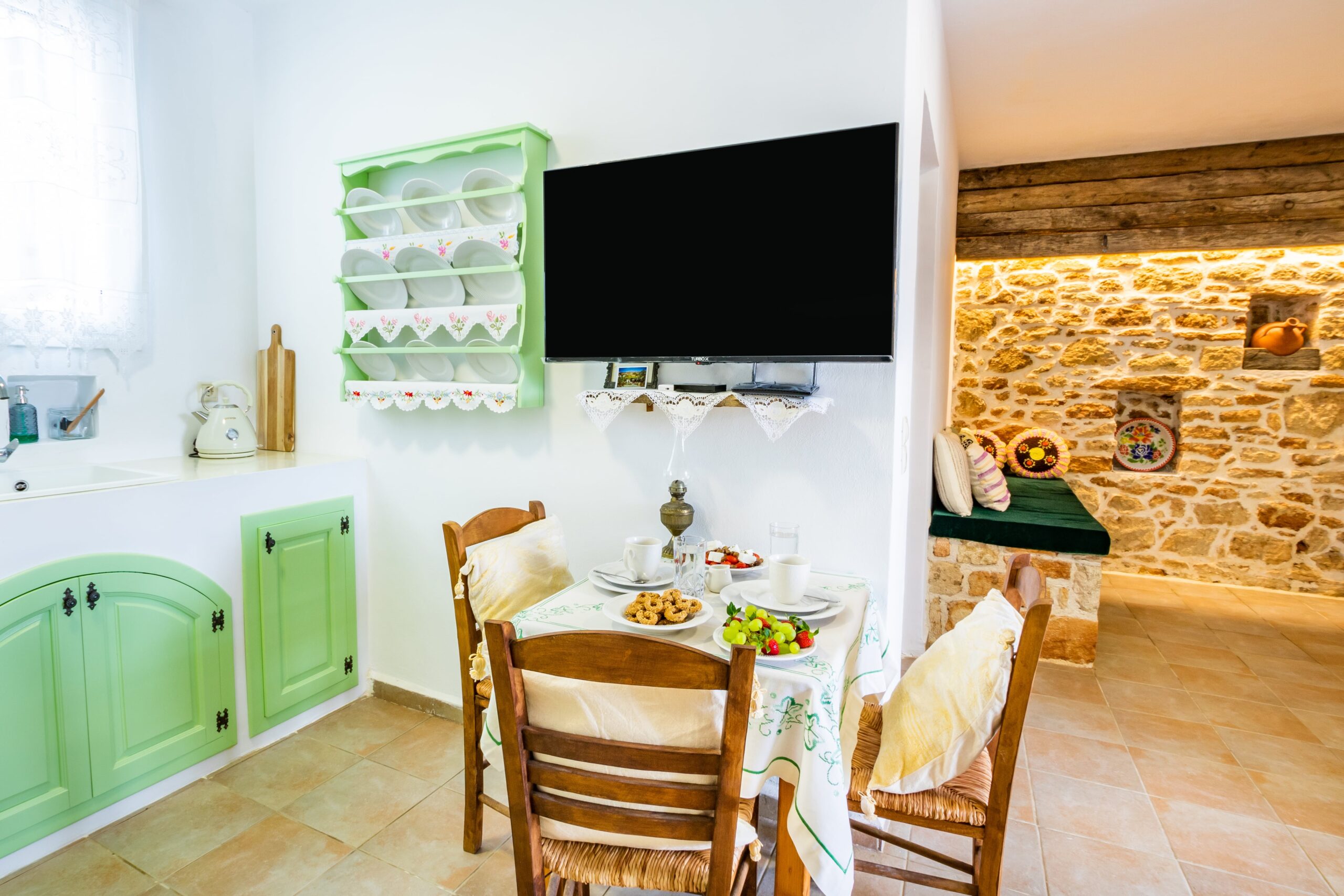 History Of The Area 8 kitchen with a table and a tv