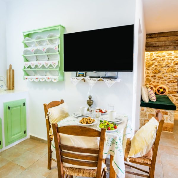 kitchen with a table and a tv